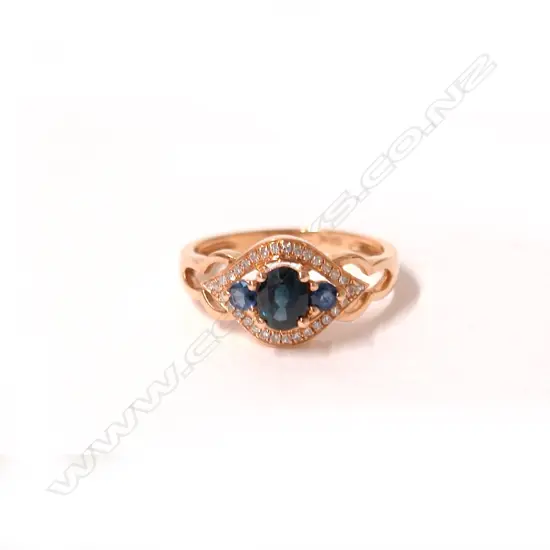 An 18ct. rose gold sapphire and diamond ring