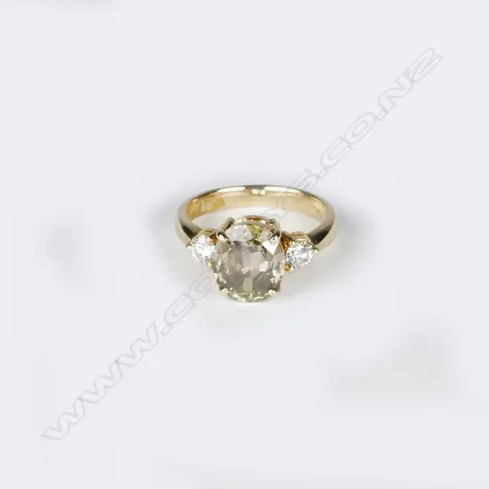 An 18ct. yellow gold peridot and diamond ring