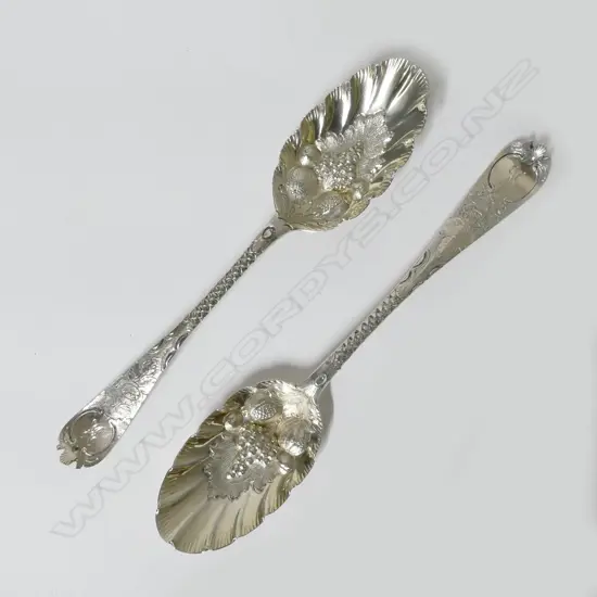 A pair of Georgian silver bottom marked berry spoons