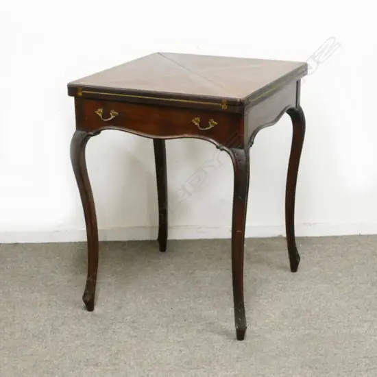 An Edwardian mahogany envelope card table