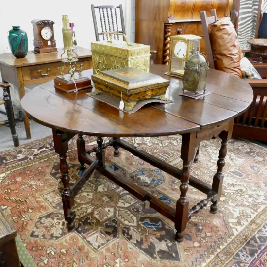 A George III oak gate-leg table