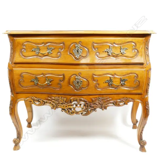A European walnut serpentine bombe commode