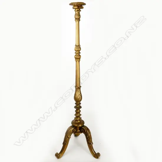 A decorative giltwood carved torchiere