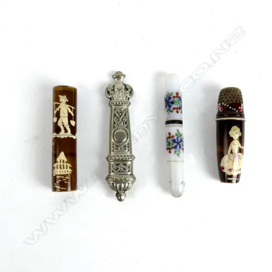 Four old needle cases