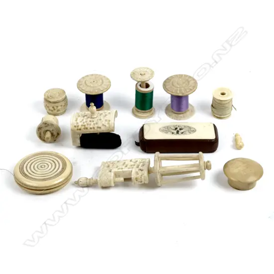 A collection of ivory and bone sewing accessories