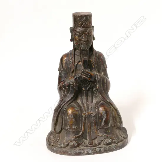 A Chinese lacquered and gilded metal figure of a scholar