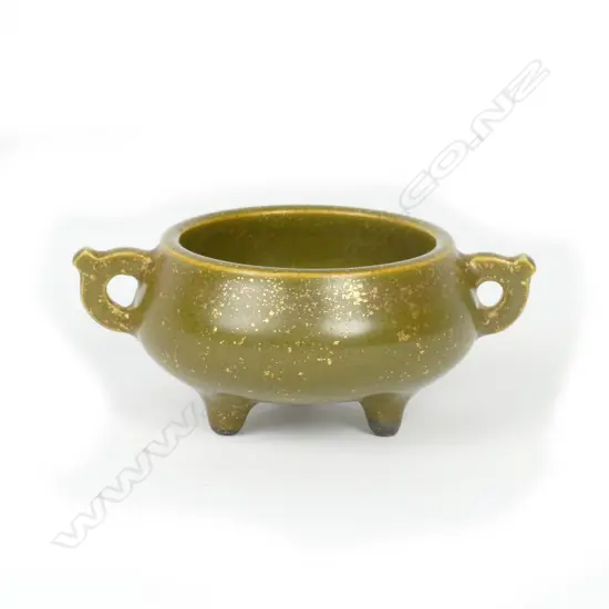 A small Chinese porcelain two-handled censer on three sprig feet