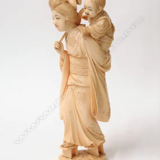 A fine quality Japanese Meiji period carved ivory figure group