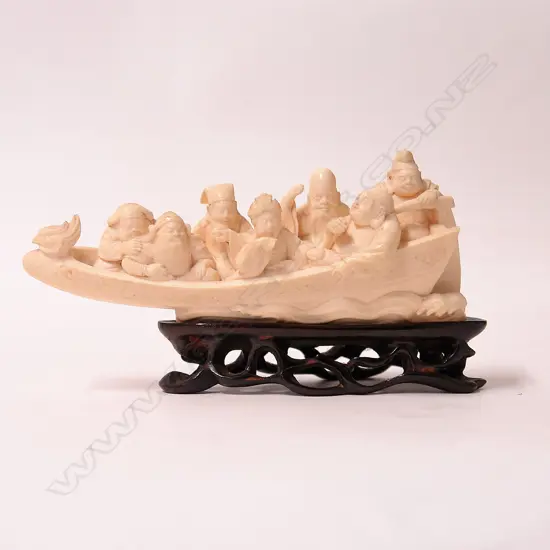 An early 20thC Japanese carved ivory figure group of the seven lucky gods aboard their takarabume
