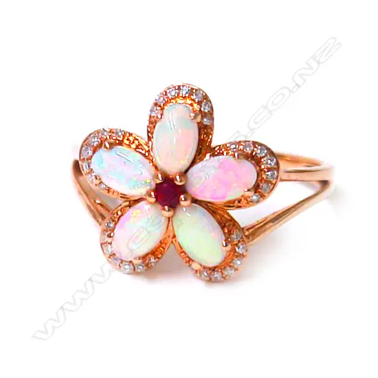 An 18ct. rose gold opal ruby and diamond ring