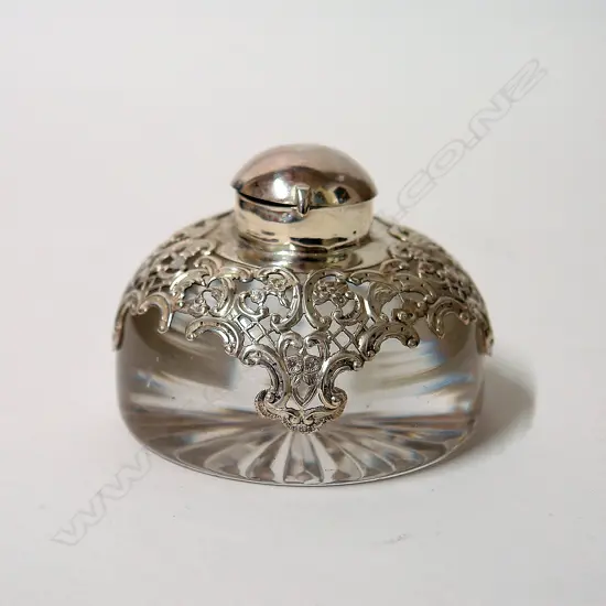 A late Victorian silver mounted glass paperweight inkwell