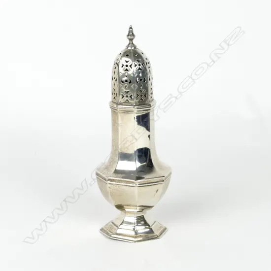 A silver caster shaker
