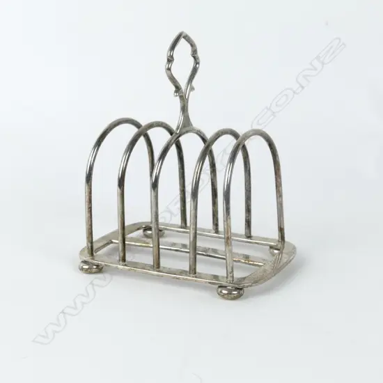 A small four-slice silver toast rack