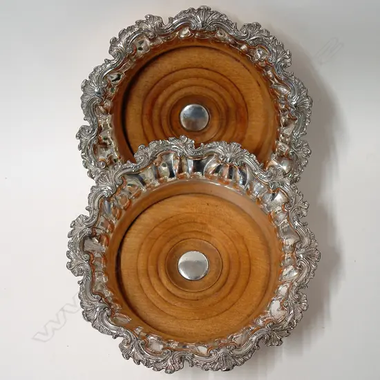 A pair of early Victorian Old Sheffield Plate decorative bottle coasters