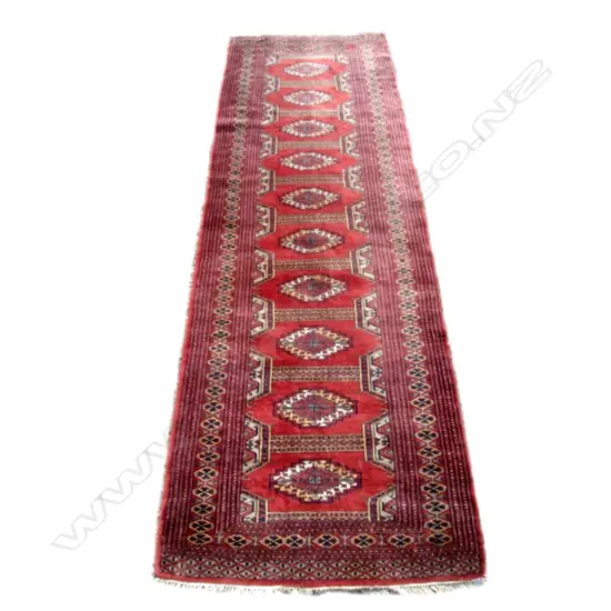 A small hand knotted Bukhara runner