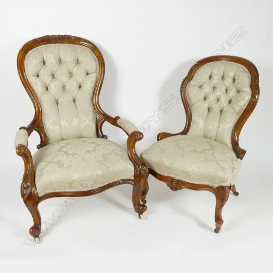 A Victorian walnut grandfather and grandmother chair