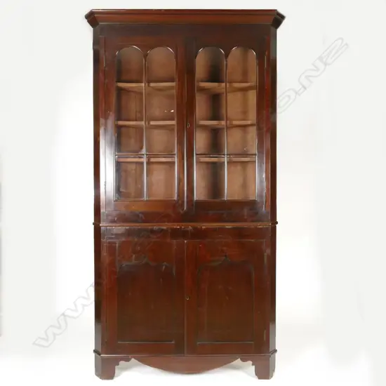 A George III mahogany standing two-section corner cabinet