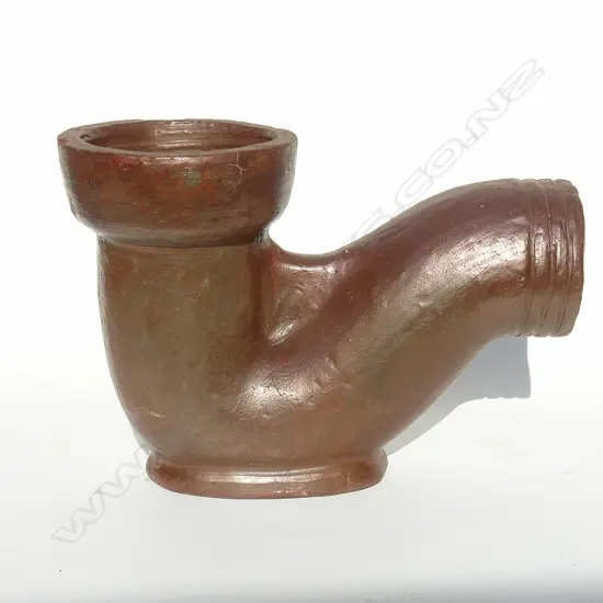 An unmarked S-form gully trap