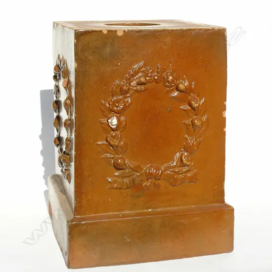 A Carder Bros. dark chocolate garden plinth stand