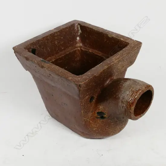 A colonial dark toffee coloured salt glazed square top gully trap