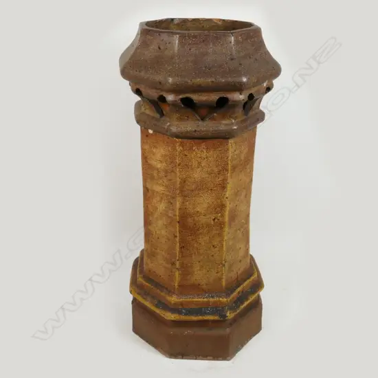 An octagonal salt glazed chimney pot