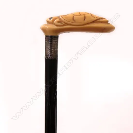 An early Bakelite type short walking stick with ivorine handle