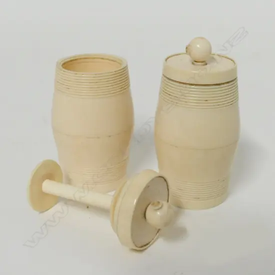 Two 19thC turned ivory barrel shaped bobbin containers