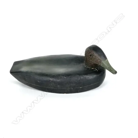 A vintage wide bodied carved wooden decoy duck