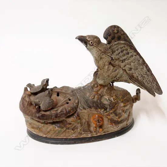 An American 1833 J. & E. Steven's Co. 'Eagle & Eaglets' cast iron mechanical money bank