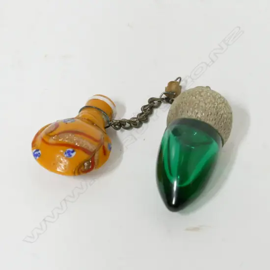 Two small glass perfume bottles