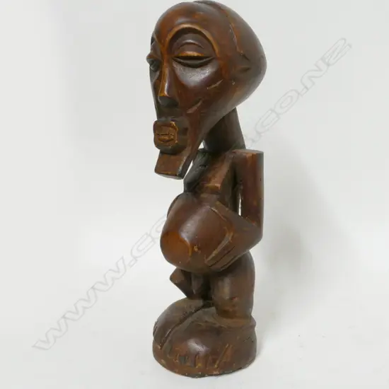 A carved Teke male figure