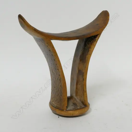 A carved North African headrest