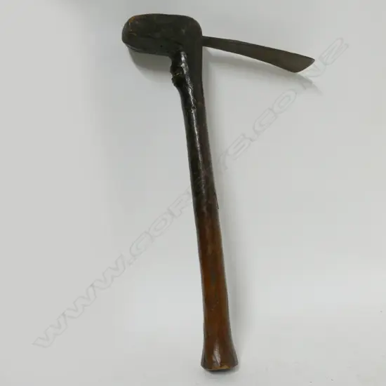 An African metal and wood hoe