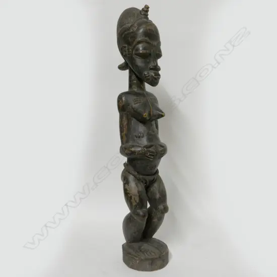 A carved Baoulé female figure