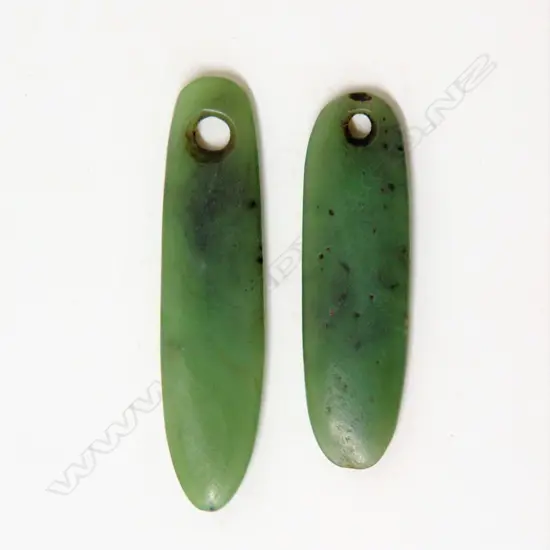 Two old Maori carved pounamu kuru (pendants)