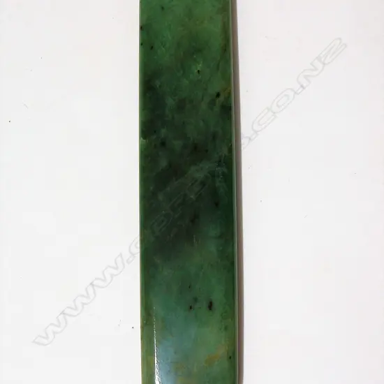 A 20thC large pounamu pendant of long parallel form