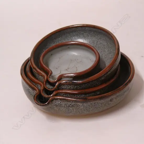 A set of four Len Castle lipped small pouring bowls