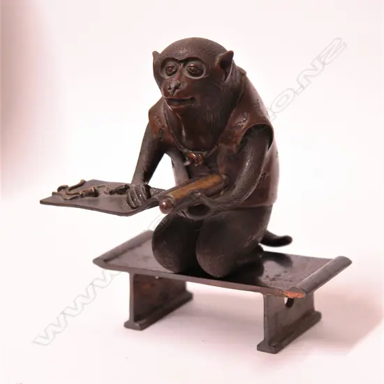 A Japanese bronze okimono