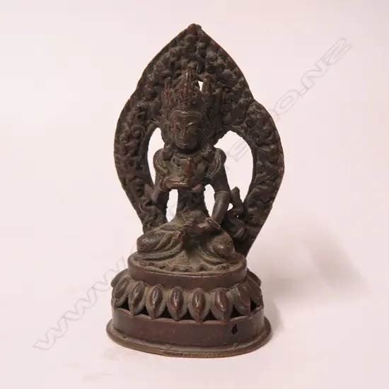 An antique Indian bronze of Vishnu upon a lotus throne