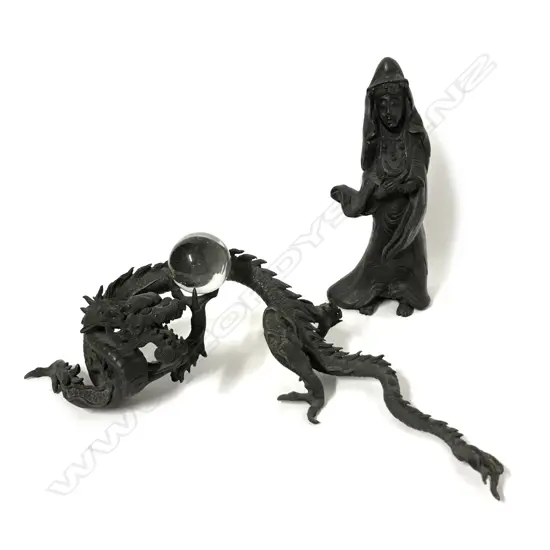 An ornate bronze Chinese dragon with small crystal ball in one claw