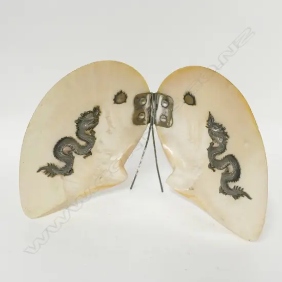 A Chinese silver set twin polished pearl shell