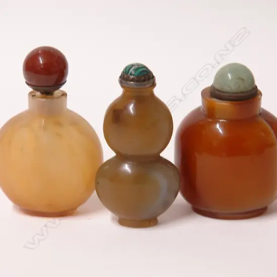Three old Chinese carved agate snuff bottles
