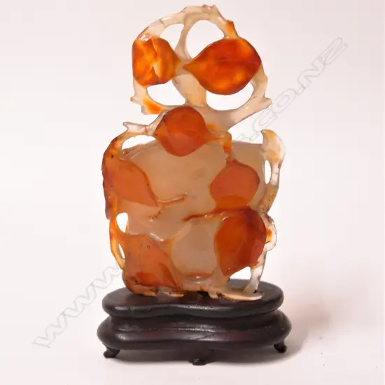 An old Chinese agate carved lidded snuff bottle