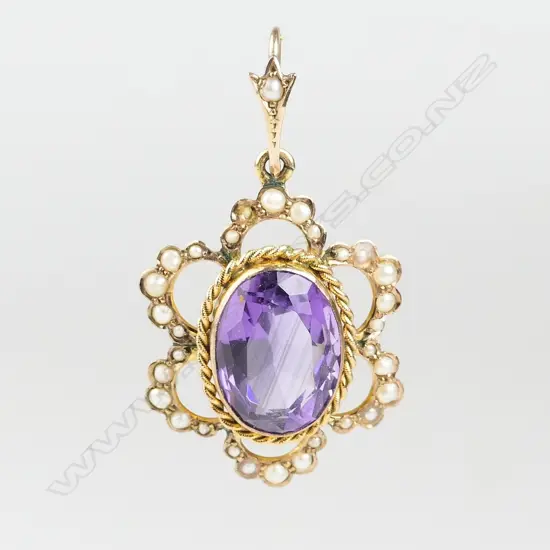 An Edwardian 9ct. gold amethyst and seed pearl pendant