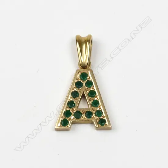 A 9ct. gold and emerald pendant