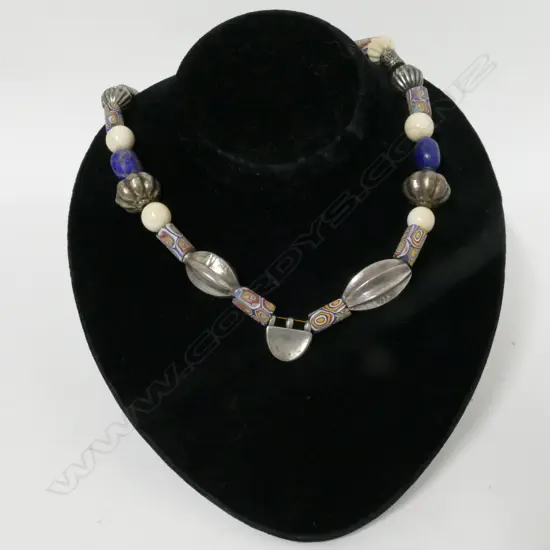 A tribal bead and silver necklace