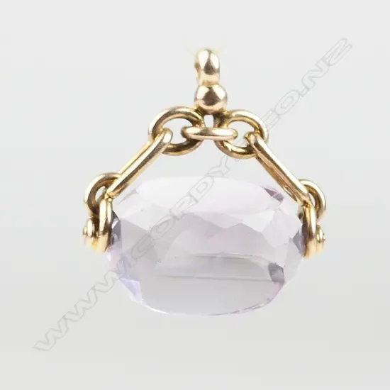 A 9ct. gold and amethyst fob spinner