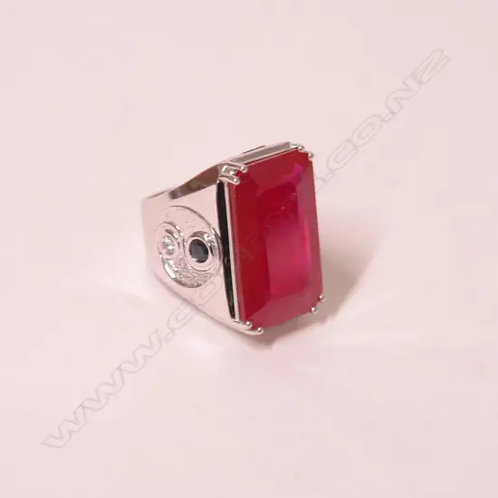 A large and impressive 18ct. white gold ruby diamond and sapphire dress ring