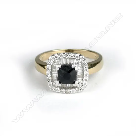 A 9ct. gold diamond and sapphire ring