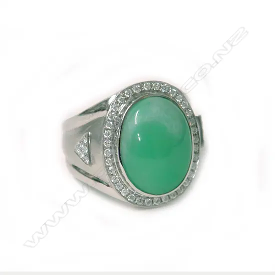 An impressive modern 18ct. white gold jadeite and diamond dress ring